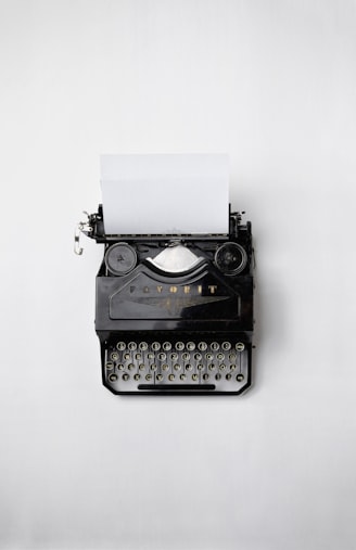 black Fayorit typewriter with printer paper