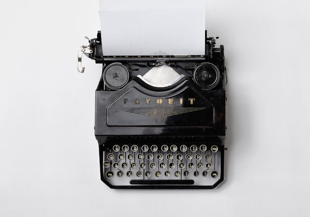 black Fayorit typewriter with printer paper