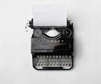 black Fayorit typewriter with printer paper