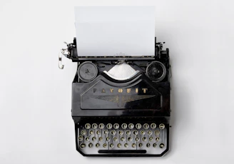 black Fayorit typewriter with printer paper