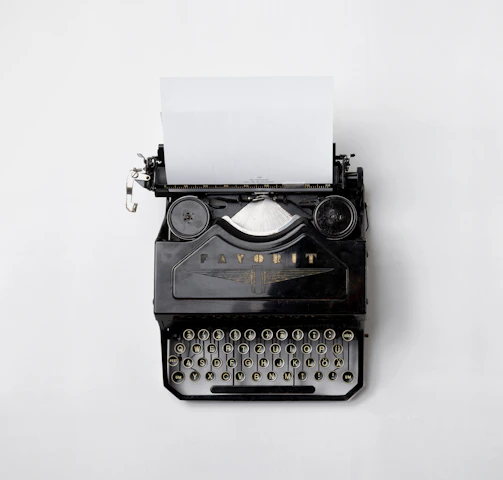 black Fayorit typewriter with printer paper
