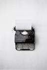 black Fayorit typewriter with printer paper