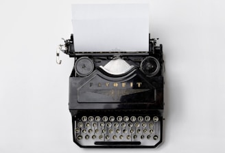 black Fayorit typewriter with printer paper