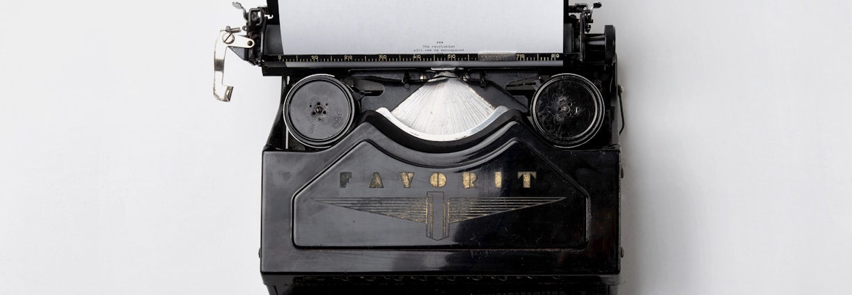 black Fayorit typewriter with printer paper