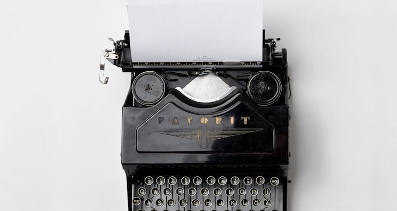 black Fayorit typewriter with printer paper