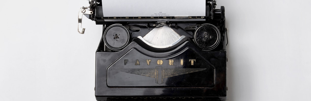black Fayorit typewriter with printer paper