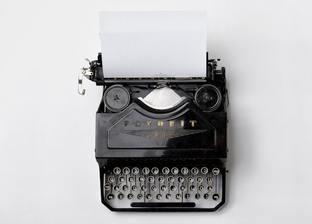 black Fayorit typewriter with printer paper