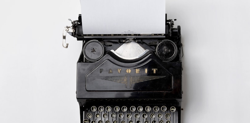 black Fayorit typewriter with printer paper
