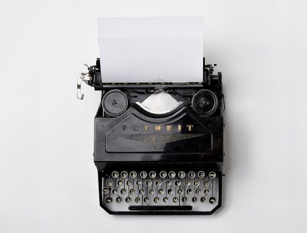 black Fayorit typewriter with printer paper