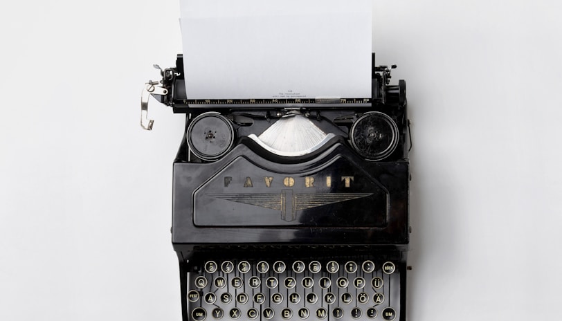 black Fayorit typewriter with printer paper