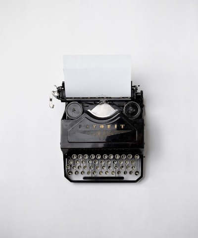black Fayorit typewriter with printer paper