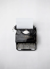 black Fayorit typewriter with printer paper