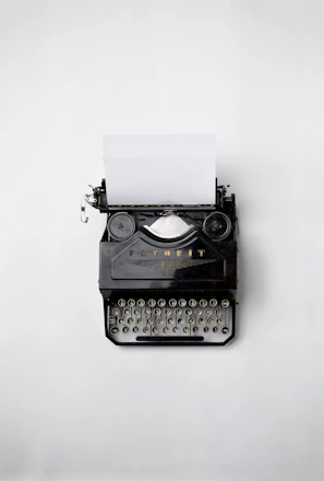 black Fayorit typewriter with printer paper