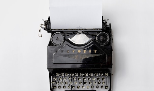 black Fayorit typewriter with printer paper