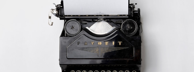 black Fayorit typewriter with printer paper