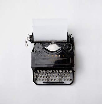 black Fayorit typewriter with printer paper