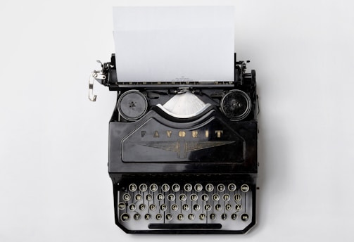 black Fayorit typewriter with printer paper