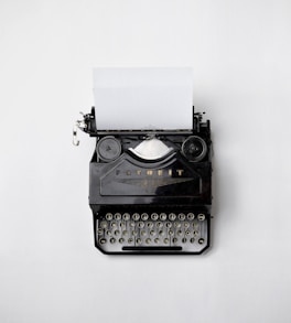 black Fayorit typewriter with printer paper