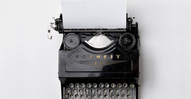 black Fayorit typewriter with printer paper