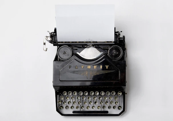 black Fayorit typewriter with printer paper