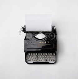 black Fayorit typewriter with printer paper