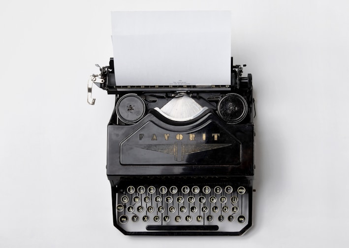 black Fayorit typewriter with printer paper