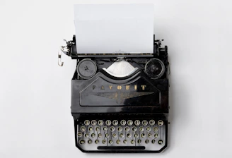black Fayorit typewriter with printer paper