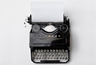 black Fayorit typewriter with printer paper