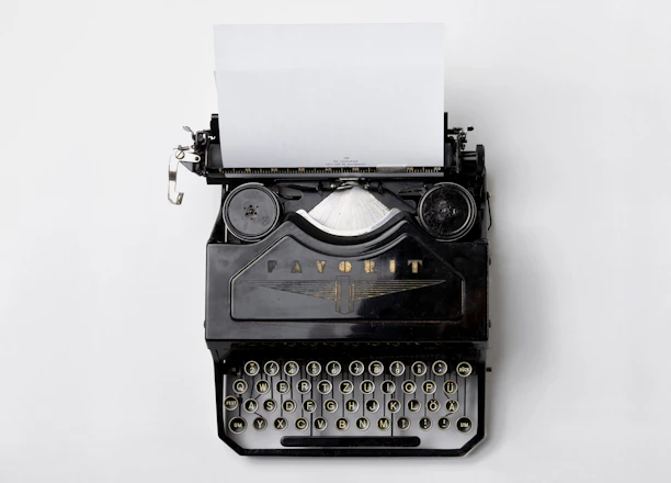 black Fayorit typewriter with printer paper