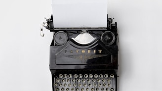 black Fayorit typewriter with printer paper
