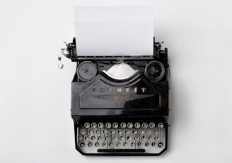 black Fayorit typewriter with printer paper