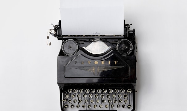 black Fayorit typewriter with printer paper
