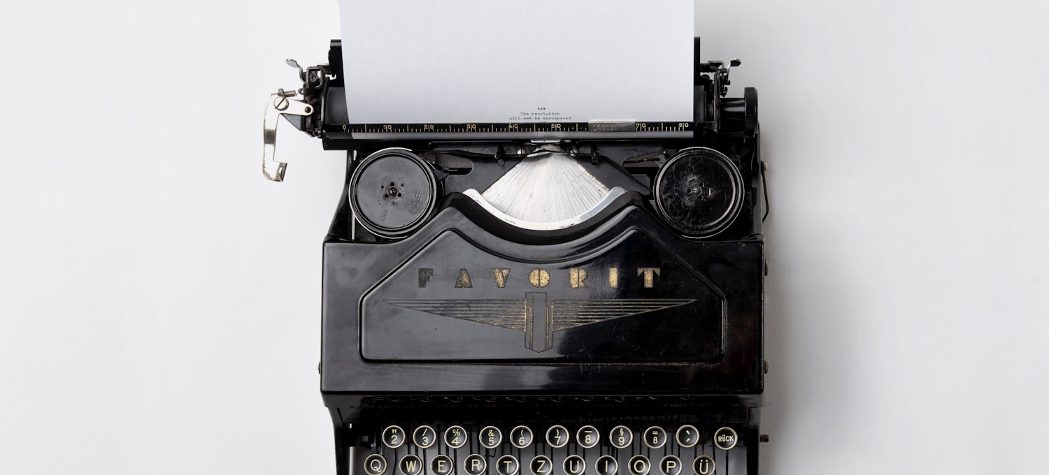 black Fayorit typewriter with printer paper
