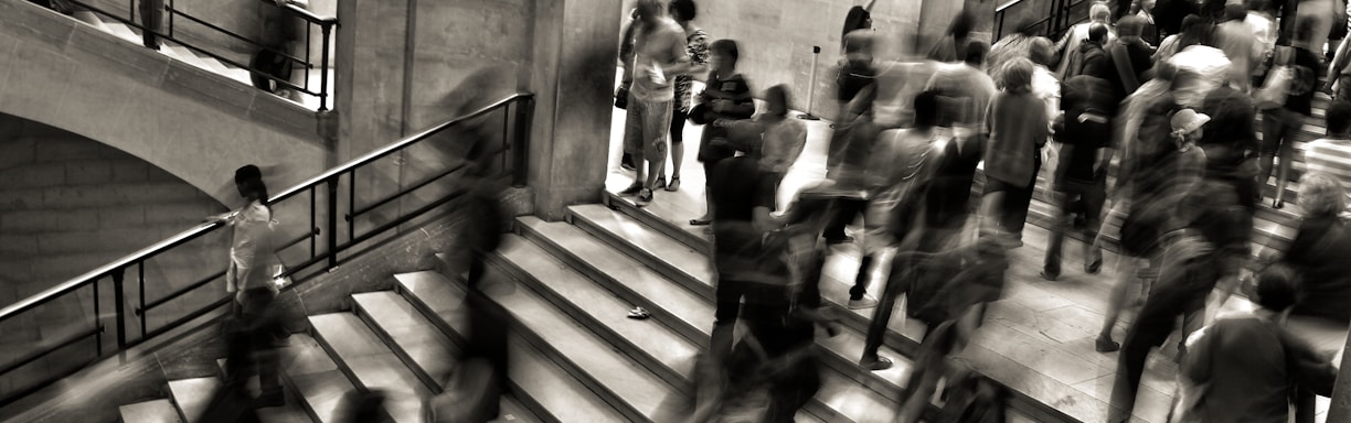 group of people walking on the stairs
