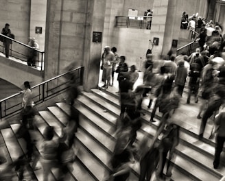 group of people walking on the stairs