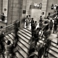 group of people walking on the stairs