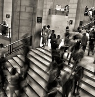 group of people walking on the stairs