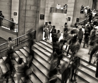 group of people walking on the stairs