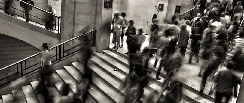 group of people walking on the stairs