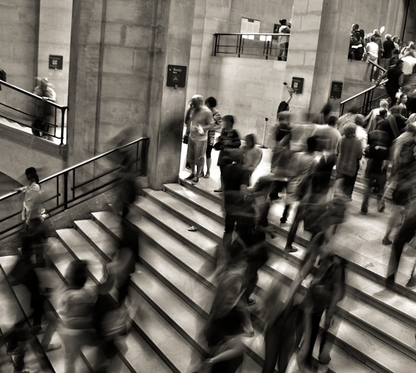 group of people walking on the stairs