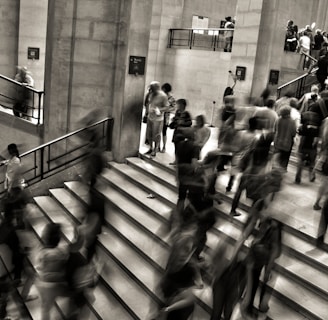 group of people walking on the stairs