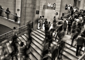 group of people walking on the stairs