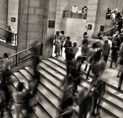 group of people walking on the stairs