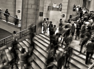 group of people walking on the stairs
