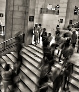 group of people walking on the stairs
