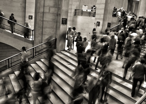 group of people walking on the stairs