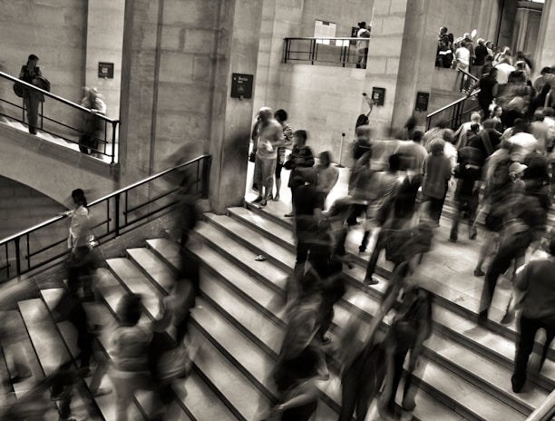 group of people walking on the stairs