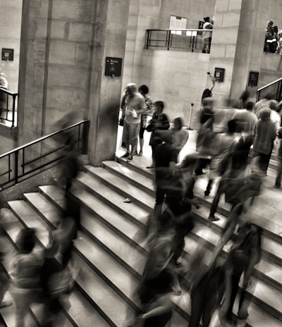 group of people walking on the stairs