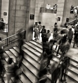 group of people walking on the stairs