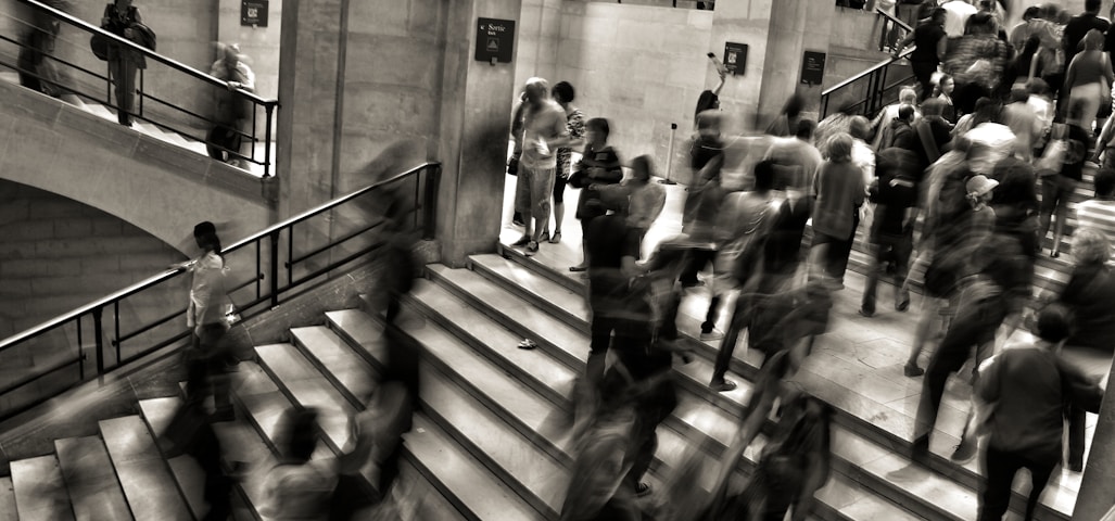 group of people walking on the stairs